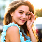beautiful young blissful smiling woman posing street bright sunny light trendy elegant blue dress natural make up positive mood